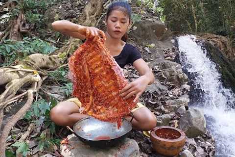 Pork ribs grilled spicy delicious for dinner near waterfall - Survival cooking in jungle